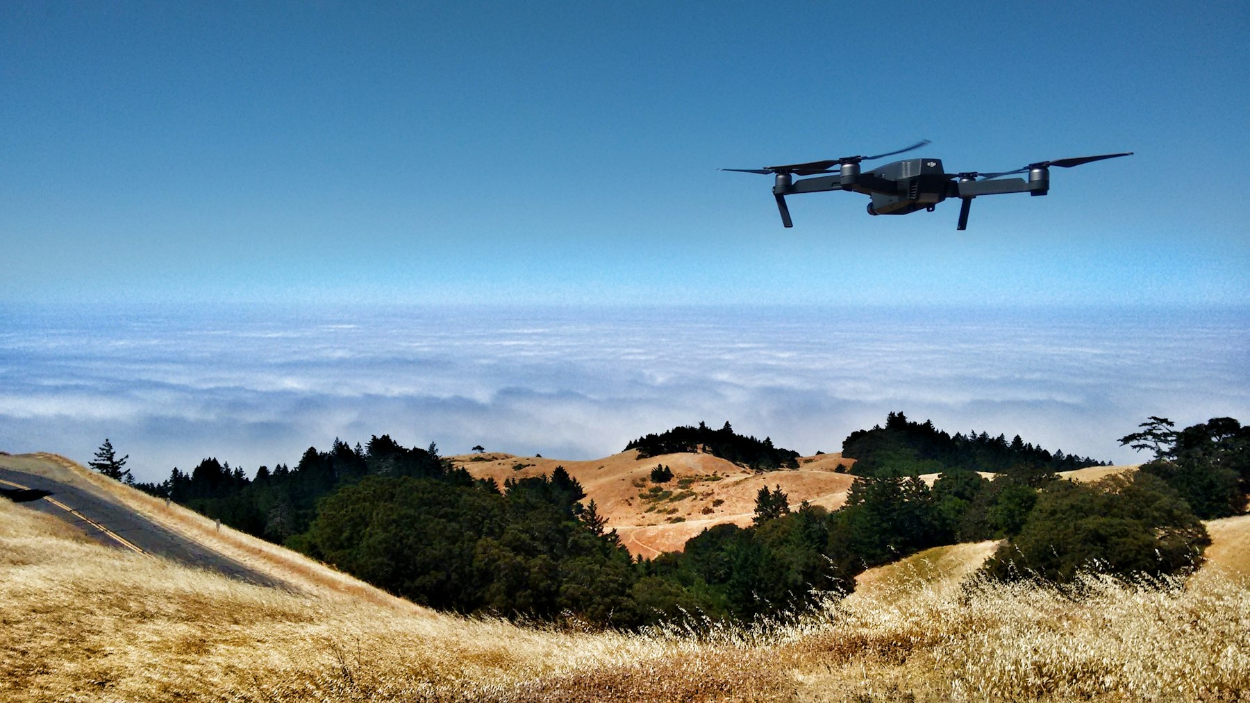 Drone flying against a cloudy sky